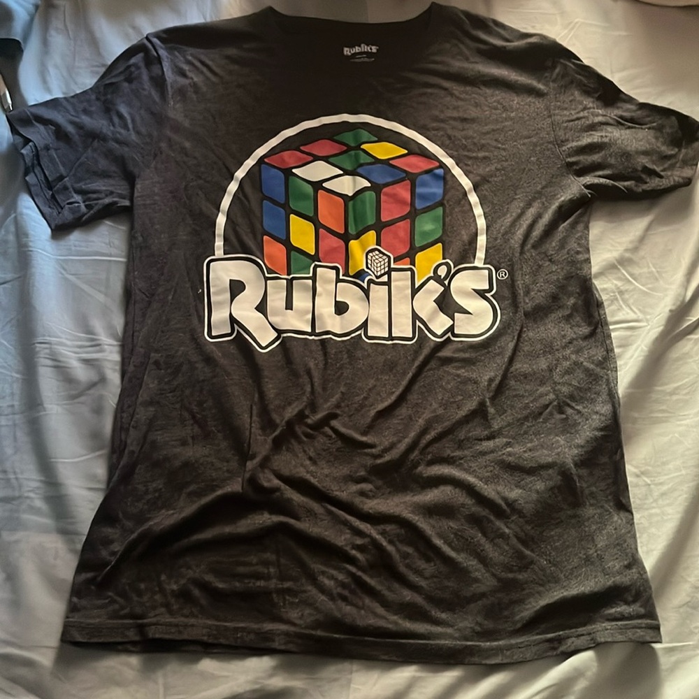 Selling this dark grey Rubik’s cube shirt, size medium, from the brand Rubik’s.